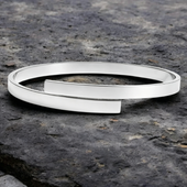 Silver couples bracelet detail, engraved names on matching bracelet pair