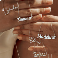 Custom script name necklace detail, cursive nameplate pendant on dainty chain